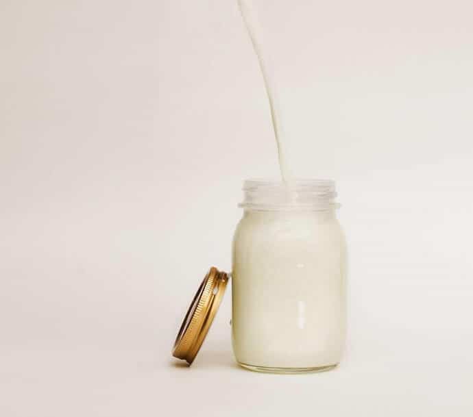 frothed cold milk in mason jar